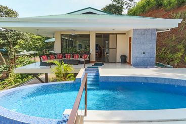 Pool and covered outdoor seating area, also outdoor shower