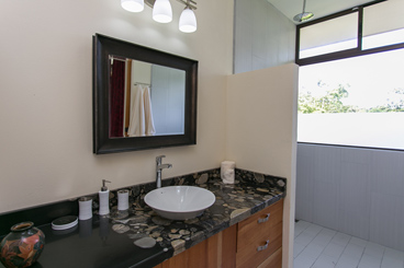 Red room guest bath with rain head shower